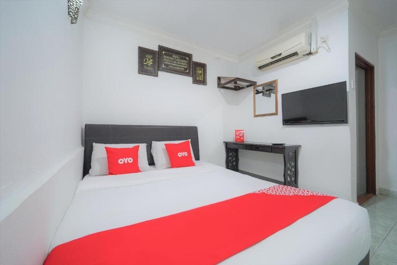 Oyo 89850 Mutiara Motel Kuah Kültér fotó